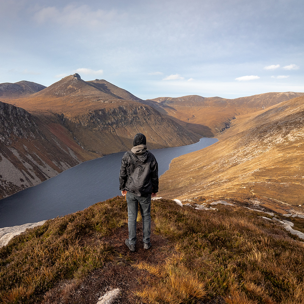 Man Standing on Mountain